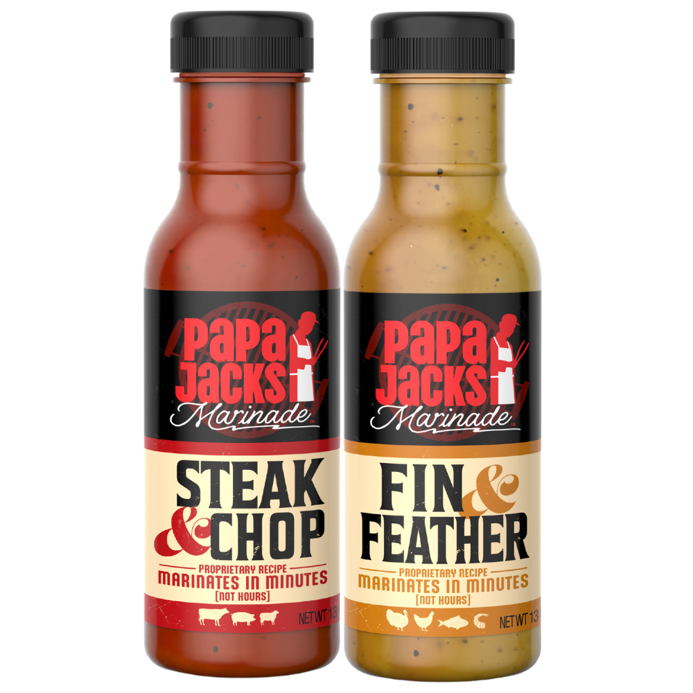 Two bottles of Papa Jacks Marinades: Papa Jacks Marinades Fin & Feather and Papa Jacks Marinades Steak & Chop, placed side by side. The Fin & Feather bottle features a label with citrus and herb imagery, highlighting its bright, zesty flavor for poultry and seafood. The Steak & Chop bottle has a bold, smoky design, emphasizing its rich seasoning blend for steaks and chops. Both bottles have a rustic, handcrafted look, designed for grilling, roasting, and marinating.